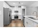 Modern kitchen features stainless steel appliances, white cabinets, and a spacious island at 3245 Major Samuals Way, Charlotte, NC 28208