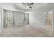 Spacious main bedroom with tray ceiling, neutral carpeting, bright windows and an attached bath at 3245 Major Samuals Way, Charlotte, NC 28208