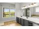 Bathroom with double sink vanity, large mirror, and tub with separate shower at 3300 Paul Heavner Ln, Lincolnton, NC 28092
