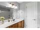 Well-lit bathroom featuring vanity with sink, large mirror, and modern fixtures at 3300 Paul Heavner Ln, Lincolnton, NC 28092