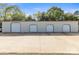 Large detached garage featuring multiple roll-up doors and ample parking space at 3300 Paul Heavner Ln, Lincolnton, NC 28092