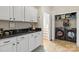Functional laundry room with modern washer, dryer, and utility sink at 3300 Paul Heavner Ln, Lincolnton, NC 28092