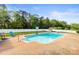 Backyard swimming pool with diving board, lounge area, and lush landscaping at 3300 Paul Heavner Ln, Lincolnton, NC 28092