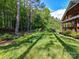 Spacious green lawn with mature trees, offering a serene and private outdoor space at 3519 Weddington Oaks Dr, Matthews, NC 28104