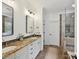 Bathroom featuring double vanity, granite countertop, and glass-enclosed shower at 3519 Weddington Oaks Dr, Matthews, NC 28104