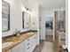 Bathroom featuring double vanity, granite countertop, and glass-enclosed shower and walk-in closet at 3519 Weddington Oaks Dr, Matthews, NC 28104