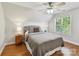 Cozy bedroom with a neutral color scheme, hardwood floors, and a large window at 3519 Weddington Oaks Dr, Matthews, NC 28104