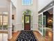 Grand foyer featuring hardwood floors, high ceilings, and elegant detailing at 3519 Weddington Oaks Dr, Matthews, NC 28104