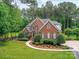 Beautiful brick home with manicured landscaping, walkway and lush green lawn at 3519 Weddington Oaks Dr, Matthews, NC 28104