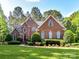 Beautiful brick home with manicured lawn and landscaping at 3519 Weddington Oaks Dr, Matthews, NC 28104