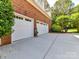 A spacious two-car garage provides ample parking and storage, complemented by a well-maintained driveway at 3519 Weddington Oaks Dr, Matthews, NC 28104