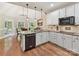 Kitchen with granite countertops, white cabinets, and a breakfast nook with backyard views at 3519 Weddington Oaks Dr, Matthews, NC 28104