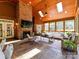 Inviting sunroom with brick fireplace, vaulted wood ceilings, skylights, and large windows for a bright and airy feel at 3519 Weddington Oaks Dr, Matthews, NC 28104