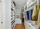 Spacious walk-in closet with custom shelving and organization system, ideal for wardrobe storage at 3519 Weddington Oaks Dr, Matthews, NC 28104
