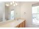 Bathroom features a large vanity and a big mirror with lots of natural light at 3937 Arbor Ln # H, Charlotte, NC 28209