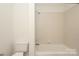 Bathroom with a standard toilet and shower/tub combo, designed for functionality at 3937 Arbor Ln # H, Charlotte, NC 28209
