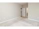 Neutral bedroom features a closet and an ensuite bathroom at 3937 Arbor Ln # H, Charlotte, NC 28209