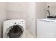 Well-equipped laundry room, featuring modern washer and dryer appliances for efficient laundry care at 3937 Arbor Ln # H, Charlotte, NC 28209