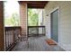 Cozy porch with seating, offering a relaxing outdoor space and neighborhood views at 3937 Arbor Ln # H, Charlotte, NC 28209