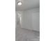 Clean and bright bedroom with neutral carpeting and a closet at 4018 Larkhaven Village Dr, Charlotte, NC 28215