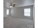 Large bedroom with carpet and two bright windows at 4018 Larkhaven Village Dr, Charlotte, NC 28215