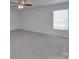Spacious bedroom with ceiling fan at 4018 Larkhaven Village Dr, Charlotte, NC 28215