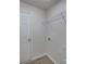 Laundry room features a utility sink, overhead shelving, and connection points at 4018 Larkhaven Village Dr, Charlotte, NC 28215
