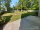 View of the backyard with grass and an outdoor fire pit at 4035 Caldwell Ridge Pkwy, Charlotte, NC 28213