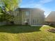 Expansive backyard with lush green lawn and a charming patio area, perfect for outdoor enjoyment at 4035 Caldwell Ridge Pkwy, Charlotte, NC 28213