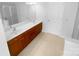 Bathroom with double sinks and a large mirror providing plenty of counter space and natural light at 4035 Caldwell Ridge Pkwy, Charlotte, NC 28213