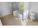 Bathroom featuring a separate shower and tub, with window and a toilet to the side at 4035 Caldwell Ridge Pkwy, Charlotte, NC 28213