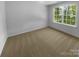 Bright, carpeted bedroom featuring a large window providing lots of natural light at 4035 Caldwell Ridge Pkwy, Charlotte, NC 28213