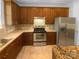 Modern kitchen boasts stainless steel appliances and ample cabinet space at 4035 Caldwell Ridge Pkwy, Charlotte, NC 28213