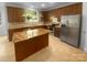 Well-equipped kitchen featuring stainless steel appliances, dark cabinetry, and a spacious island at 4035 Caldwell Ridge Pkwy, Charlotte, NC 28213