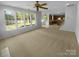 Open-concept living area with large windows providing abundant natural light at 4035 Caldwell Ridge Pkwy, Charlotte, NC 28213