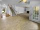 Open floor plan with stairs, large living room with fireplace and access to exterior at 4035 Caldwell Ridge Pkwy, Charlotte, NC 28213