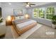 Serene main bedroom with soft lighting, a plush rug, and a comfortable, inviting layout at 4035 Caldwell Ridge Pkwy, Charlotte, NC 28213