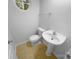 This is a cozy powder room with neutral walls, flooring and pedestal sink at 4035 Caldwell Ridge Pkwy, Charlotte, NC 28213