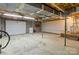 Unfinished basement with concrete floor, exposed ceiling, and cinder block walls at 4050 Leafmore St, Concord, NC 28027