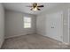 Bedroom with neutral walls, carpet, and large closet at 4050 Leafmore St, Concord, NC 28027