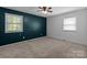 Bedroom with neutral carpet and two large windows for plenty of sunlight at 4050 Leafmore St, Concord, NC 28027