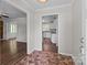Welcoming foyer with brick flooring and views into the living room and updated kitchen at 4050 Leafmore St, Concord, NC 28027