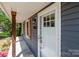 Close-up of the front door with sidelights and wooden shutters at 4050 Leafmore St, Concord, NC 28027