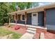 Charming front porch with wooden columns and shutters, and stone steps at 4050 Leafmore St, Concord, NC 28027