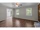 Bright living room with wood flooring, large windows and a view of the front door at 4050 Leafmore St, Concord, NC 28027