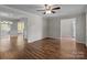 Spacious living room with wood flooring and access to the kitchen and foyer at 4050 Leafmore St, Concord, NC 28027