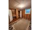 Cozy finished basement with wood paneling, carpet, storage, and a closet space at 406 S Caldwell Ave, Newton, NC 28658