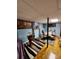 Basement dining area with colorful carpet, light fixture and window at 406 S Caldwell Ave, Newton, NC 28658