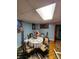 Basement dining area with window and decorative accents and bright light fixture at 406 S Caldwell Ave, Newton, NC 28658