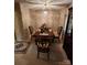 Dining room with vintage wallpaper, carpet flooring, and cozy seating at 406 S Caldwell Ave, Newton, NC 28658